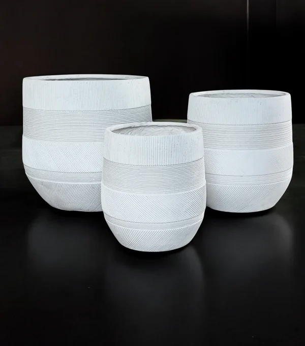 White Fiber Cement Round Planter Set with geometric horizontal and diagonal patterns, three planters of varying sizes, ideal for indoor or outdoor use.