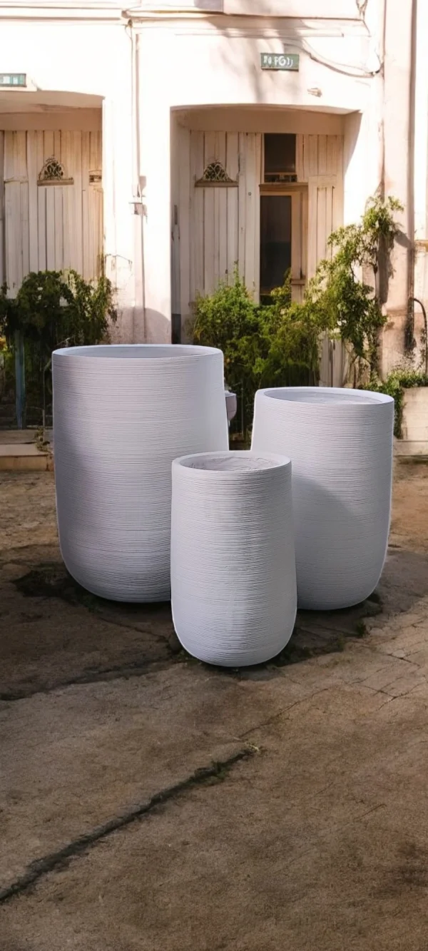 White Fiber cement Round Planter Set with a textured finish and rounded design, featuring three planters of varying sizes, perfect for modern indoor and outdoor decor.